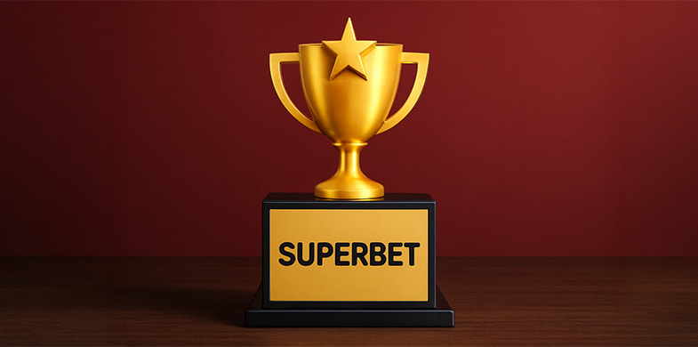 Superbet scris cu negru pe fundal aurie al unei cupe câștigătoare